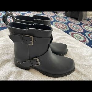 Navy blue moto rain boots.